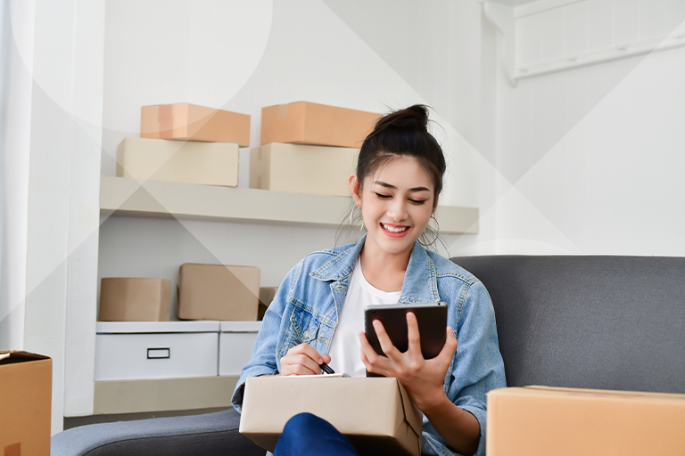 Woman using two tablets